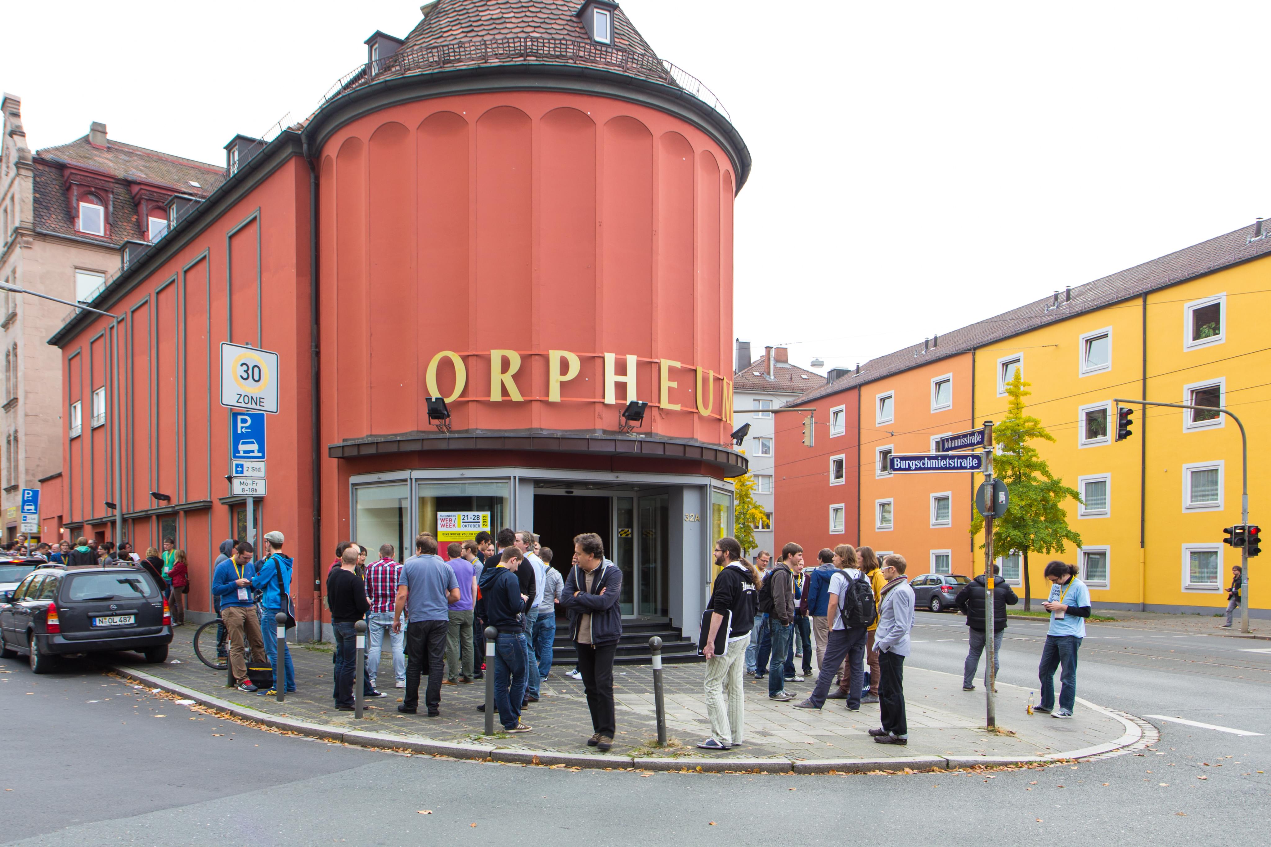 Group of people is standing outside of the Orpheum in Nuremberg, Germany